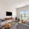 a living room with a tv and couches