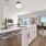 a kitchen with a table and chairs
