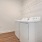 a white washing machine in a room