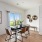 a dining room with a table and chairs