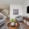 a living room with a tv and couches