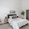 a bedroom with a bed and a chair